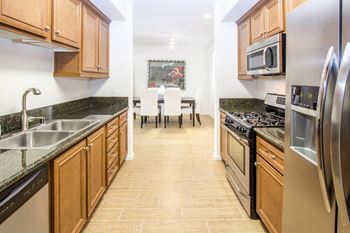 Spacious Kitchen with Pantry Cabinet at Le Blanc Apartment Homes, Canoga Park, CA, 91304